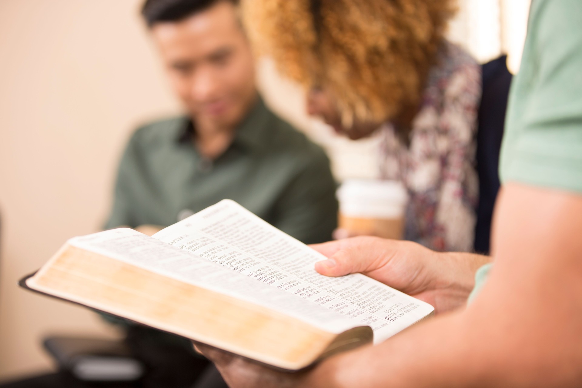 Multi-ethnic, mixed age bible study group.